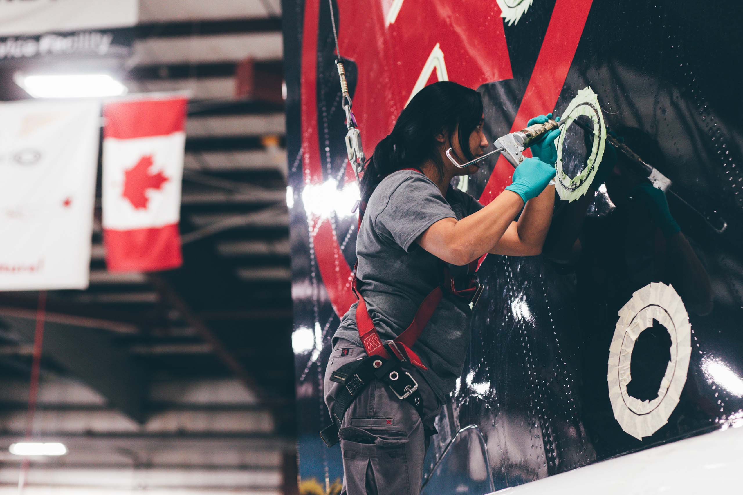 A person working on an aircraft from Jazz